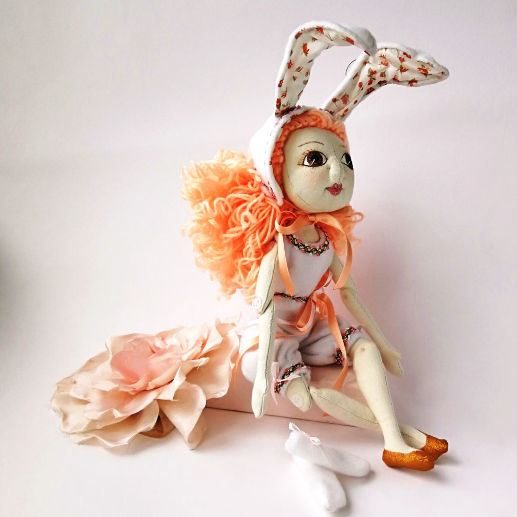 soft sculpted doll in a bunny outfit