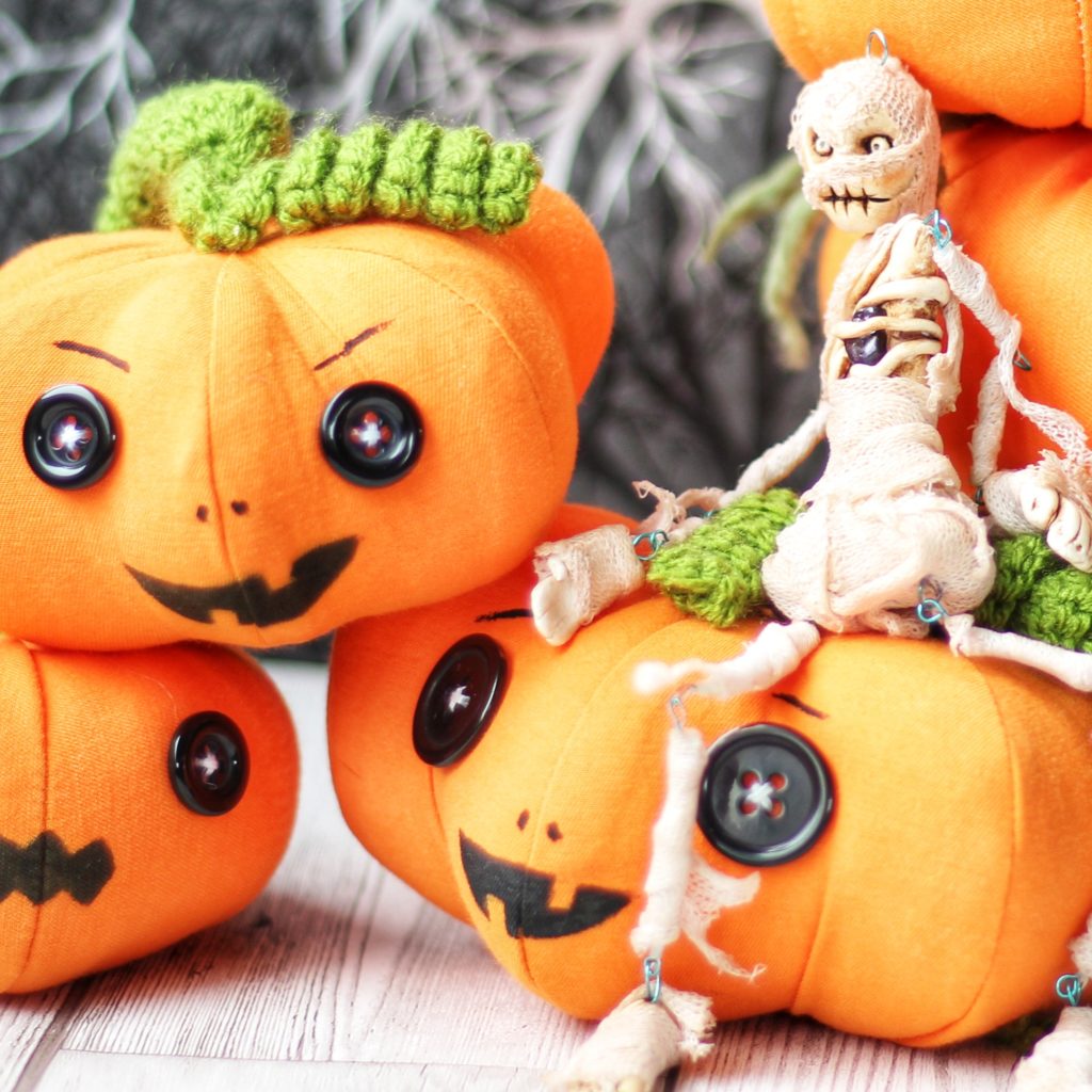 pumpkins and a mummy art doll