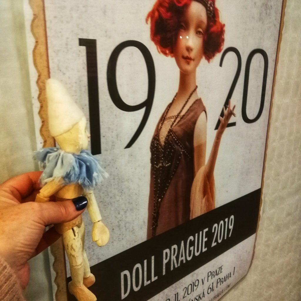 Maurice next to the Doll Prague poster