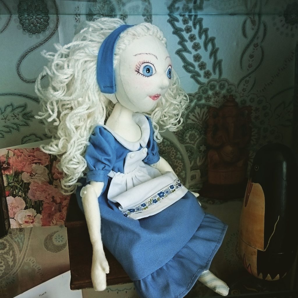 Alice sitting on a shelf