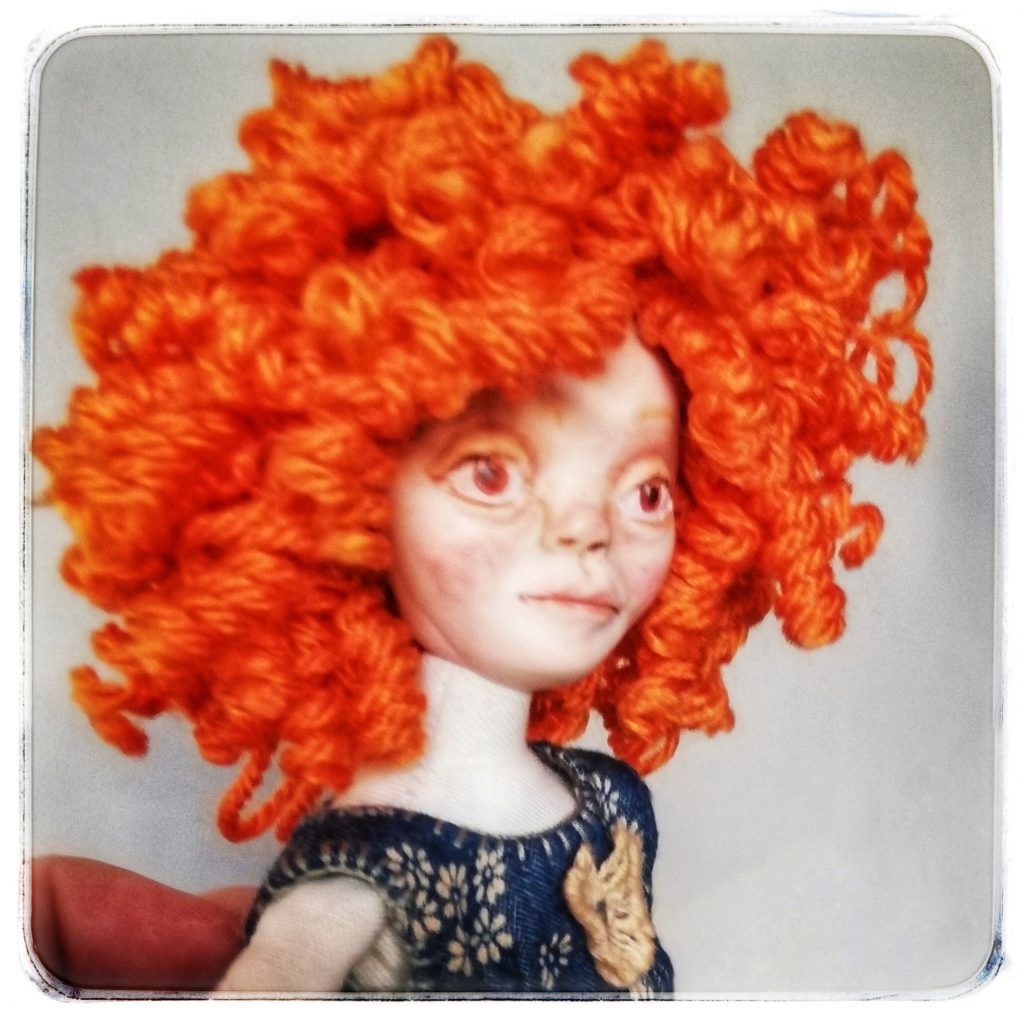 art doll with curly red hair