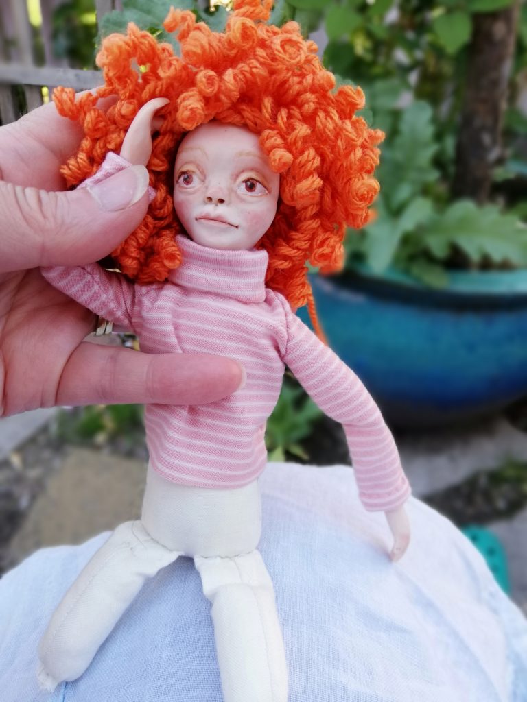 art doll with curly wig