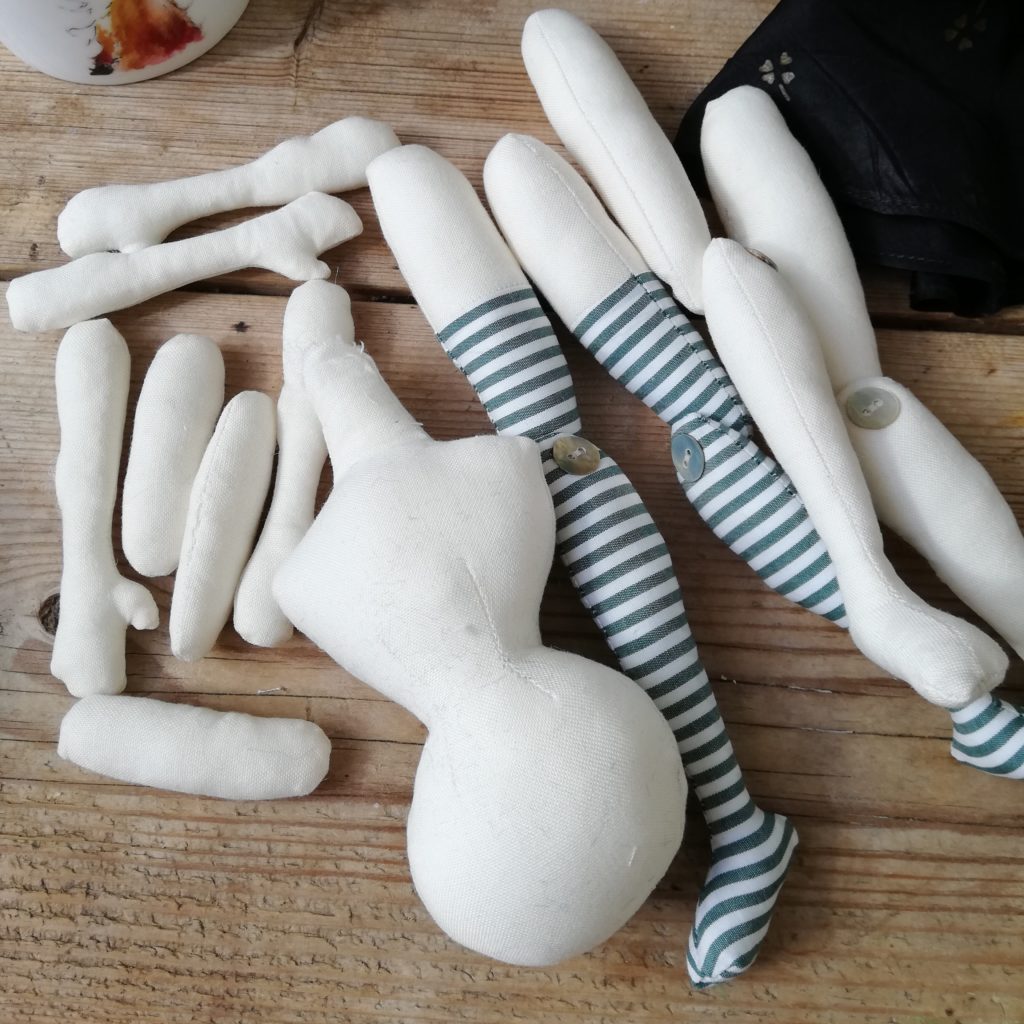 parts of a cloth art doll 