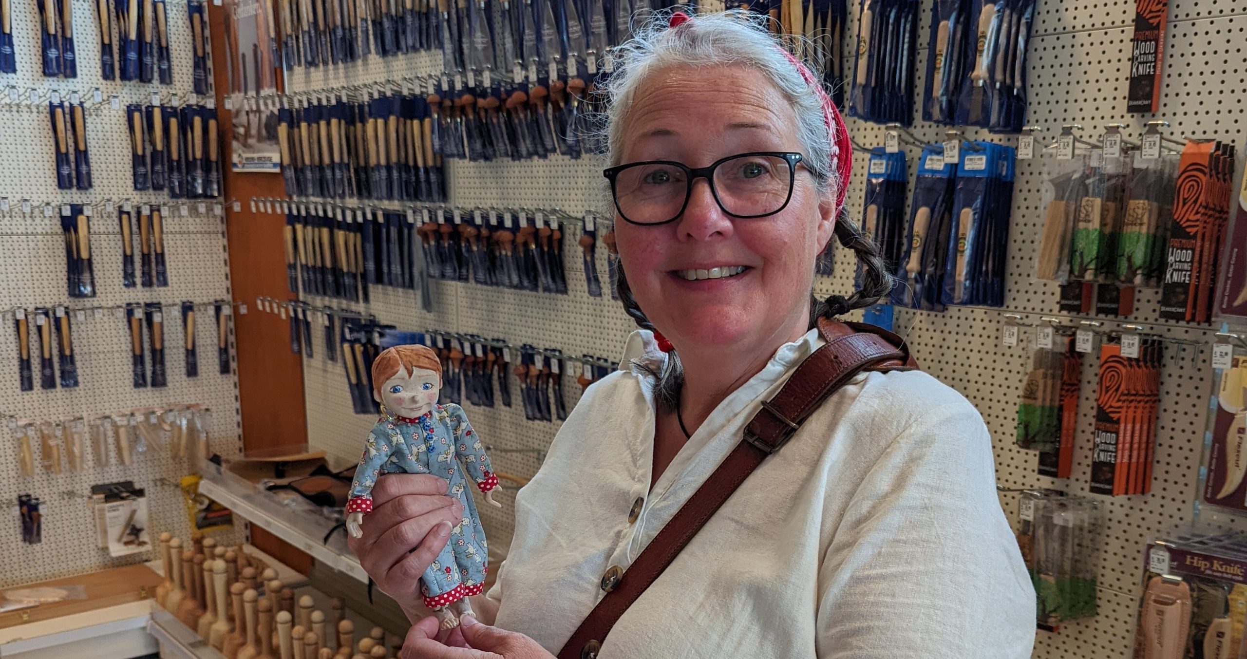 Alison Jackson holding one of her puppets
