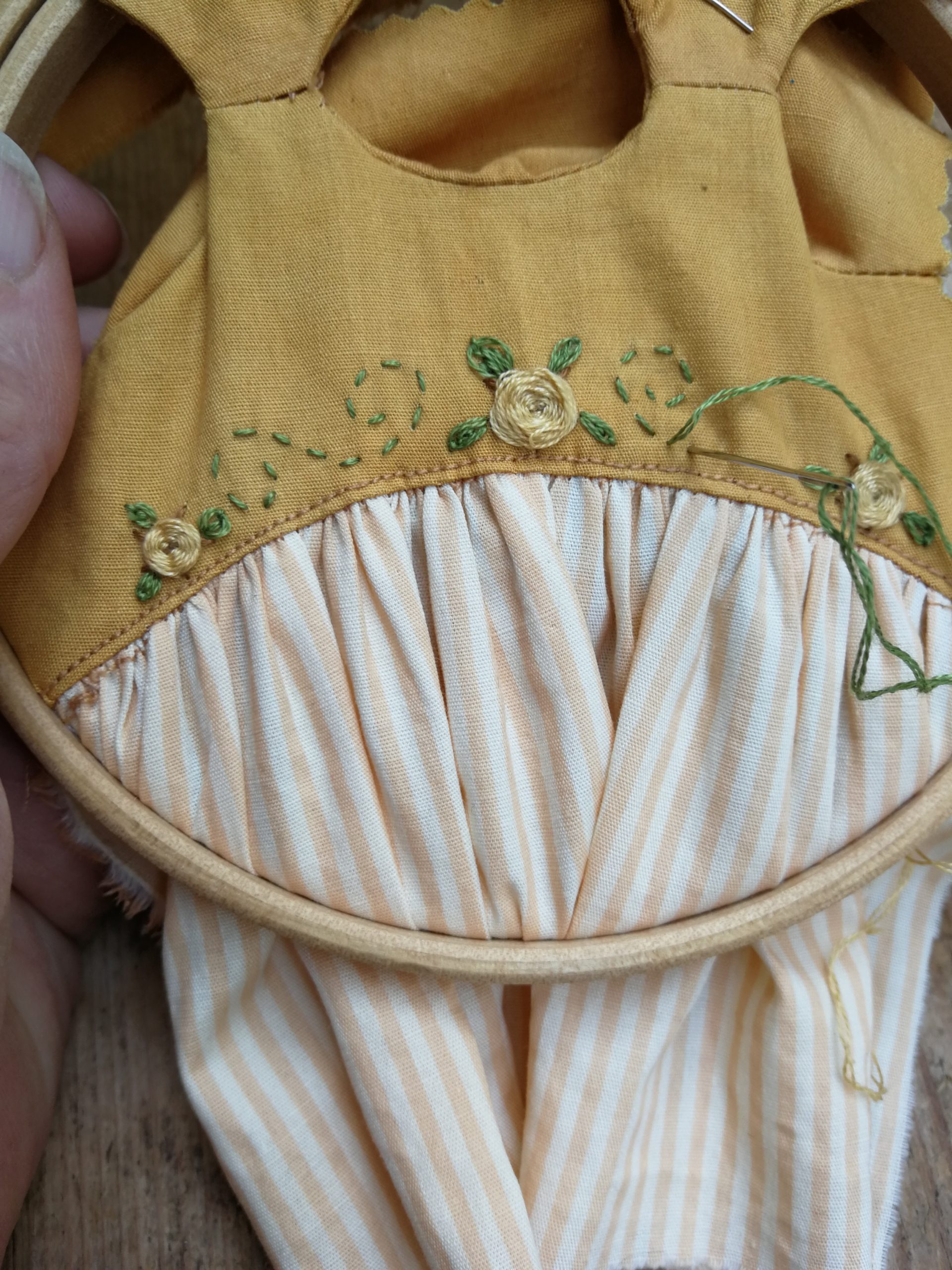 hand embroidery on a dolls dress