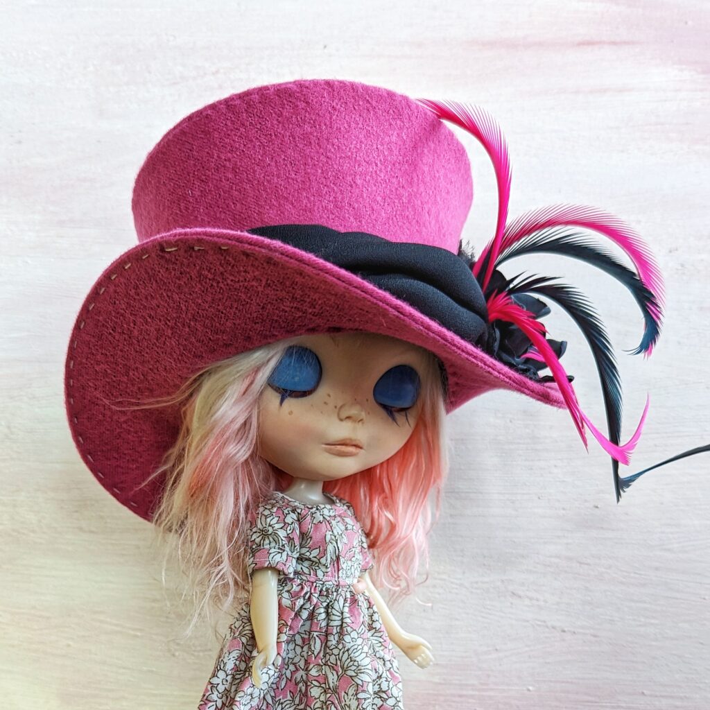 custom blythe in a pink top hat