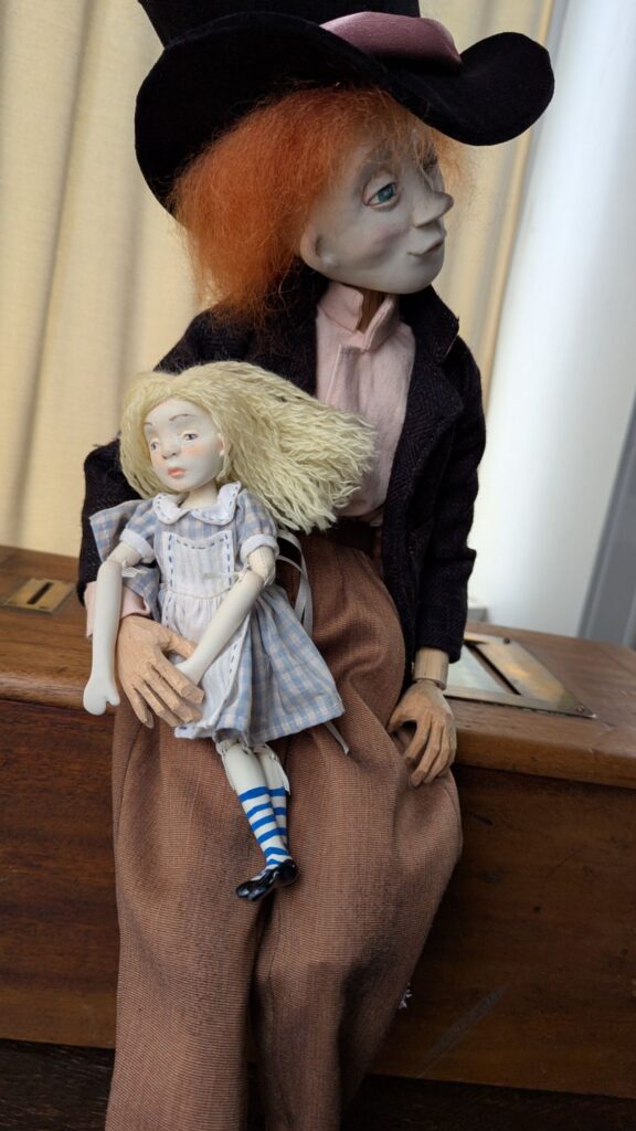 mad hatter and Alice porcelain dolls